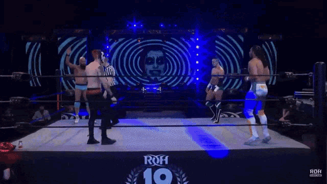 a group of wrestlers are standing in a ring that says roh 10
