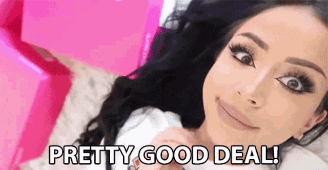 a woman is laying on a bed with the words `` pretty good deal '' written on the bottom of her face .