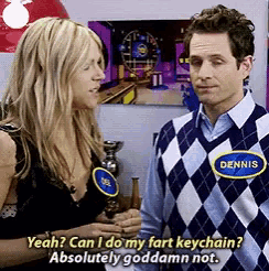 a man and a woman are standing next to each other and the man is wearing a plaid vest with the name dennis on it
