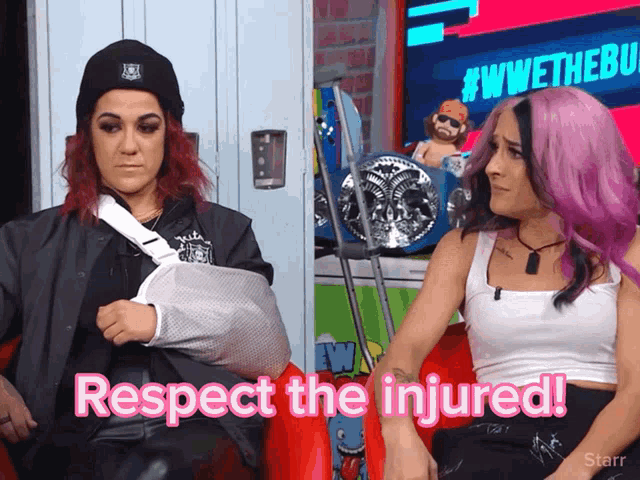a woman with a cast on her arm is sitting next to another woman with pink hair and the words respect the injured
