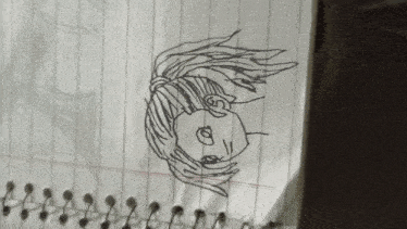 a drawing of a girl with a ponytail is on a piece of paper
