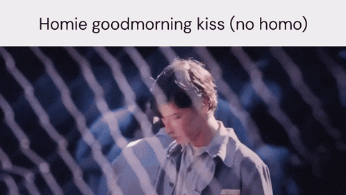 a picture of a man behind a fence with the words " homie goodmorning kiss ( no homo ) "