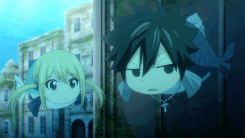 a boy and a girl are standing next to each other and the girl is wearing a necklace with a cross on it