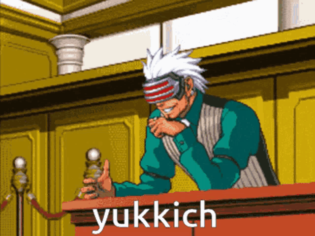 a pixel art drawing of a man sitting at a podium with the word yukkich written below him