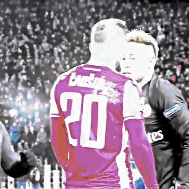a soccer player with the number 20 on his back