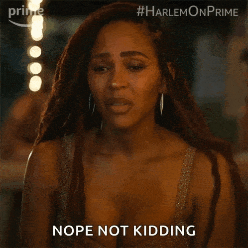 a woman with dreadlocks and a plunging neckline is saying nope not kidding .