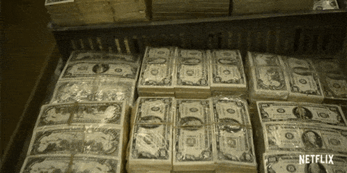 several stacks of money are stacked on top of each other with the word netflix in the corner
