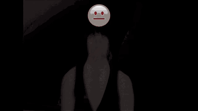 a man in a vest and tie is standing in front of a yellow smiley face