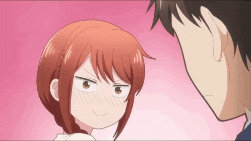 a man and a woman are looking at each other