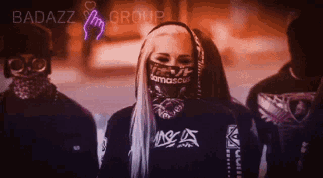 a woman wearing a bandana that says damascus
