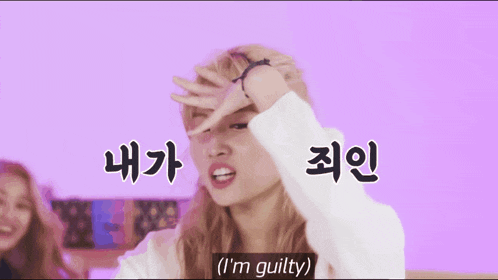 a woman covering her face with her hand and says i 'm guilty in korean