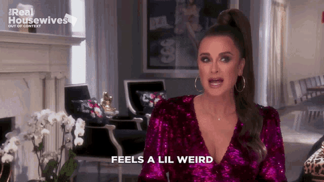 a woman in a purple sequined top says feels a lil weird