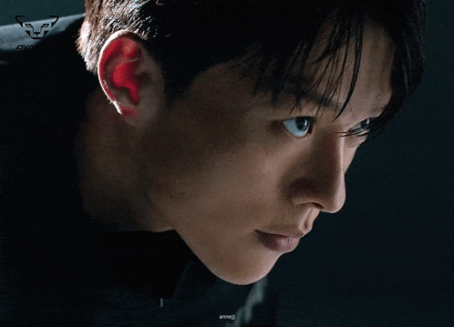 a close up of a man 's face with a drawing of a tiger on it