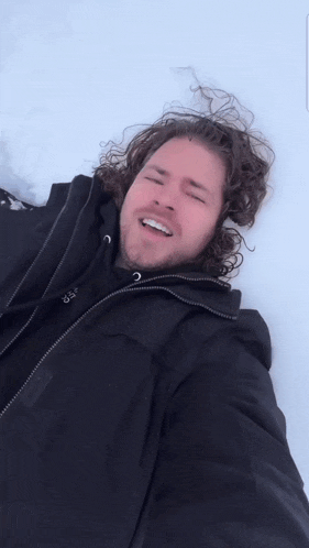 a man laying in the snow with the words " when you realize snow angels won 't save you "
