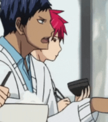 a couple of anime characters are sitting next to each other . one of the characters has red hair .