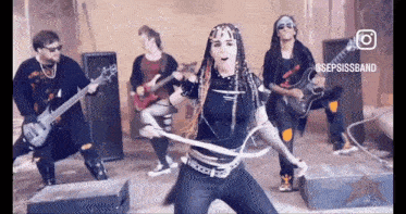 a group of people are playing instruments and one of them is wearing a black shirt that says sepsissband