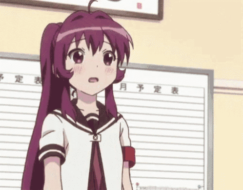 a girl with purple hair is standing in front of a board with japanese writing on it .