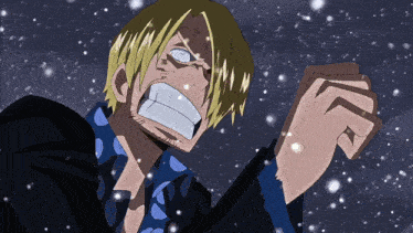 a man with blonde hair and a blue shirt is standing in the snow with his fist in the air