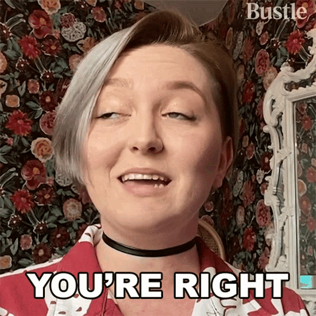 a woman says you 're right in front of a floral wall