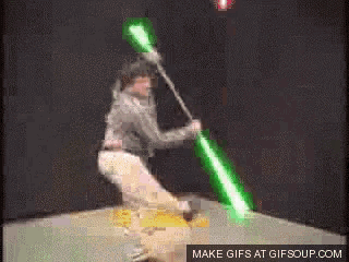 a gif of a person holding a green light saber with the words make gifs at gifsoup.com at the bottom