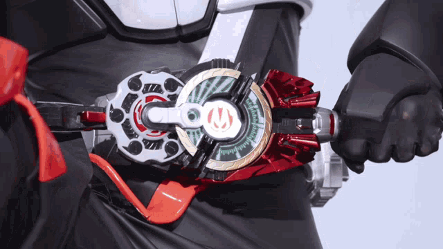 a person is wearing a belt with a red and white item that says ' samurai ' on it