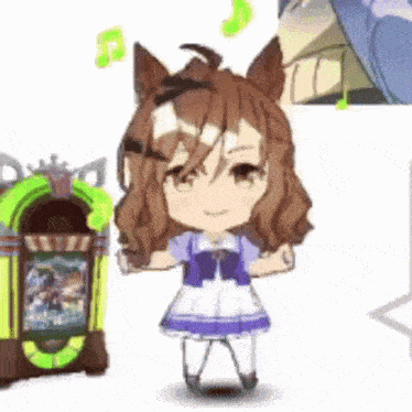 a little girl is standing next to a jukebox and playing music .