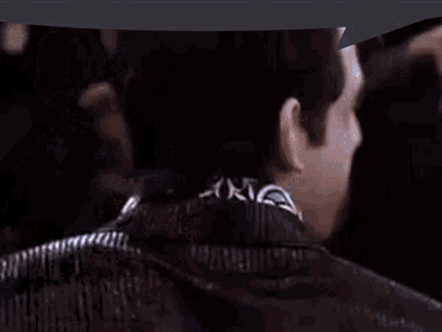 a pixelated image of a man 's face with a speech bubble behind him