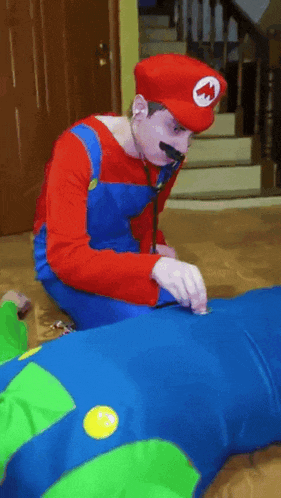 a man in a mario costume is examining a child