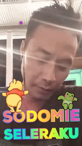 a man with a frog and winnie the pooh on his shirt that says sodome seleraku