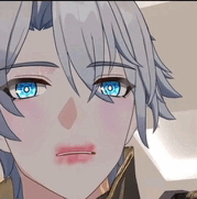 a close up of a person 's face with gray hair and blue eyes