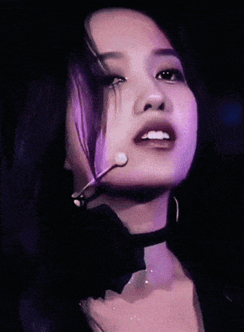 a close up of a woman wearing a choker
