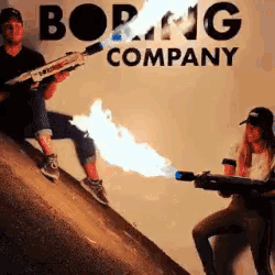 a man and a woman are holding flame throwers in front of a sign that says boring company