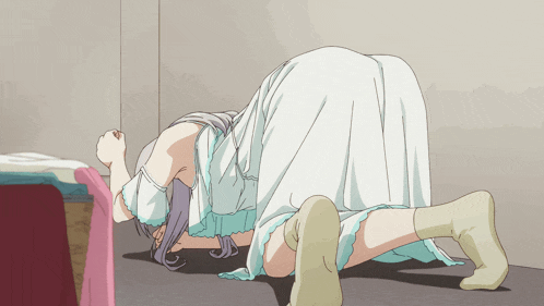 a girl in a white dress is kneeling down