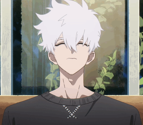 a man with white hair is wearing a black shirt with a z on it