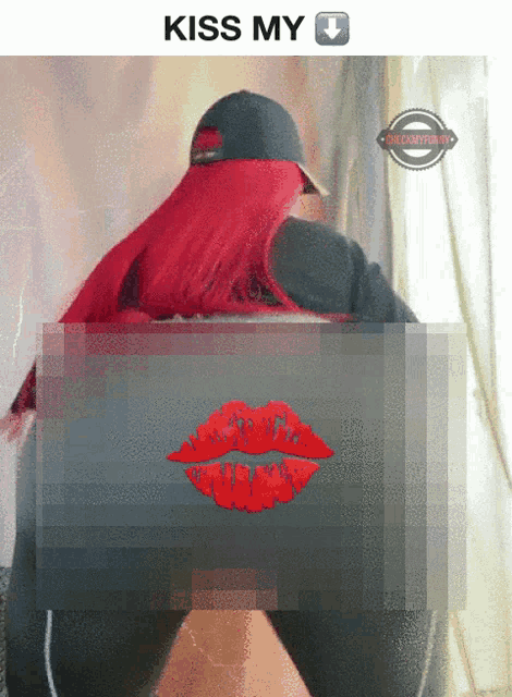 a picture of a woman with red hair and the words kiss my on the top
