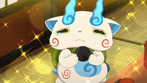 a cartoon cat with blue horns is crying and holding a black object