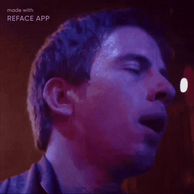 a close up of a man 's face with his eyes closed .