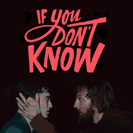 two men are standing next to each other in front of a sign that says ' i dont know '
