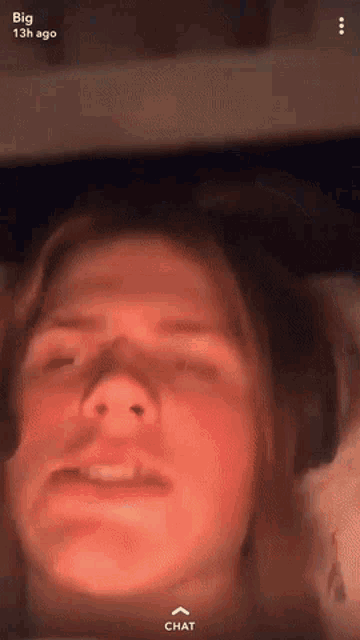a close up of a person 's face with the words big 13h ago visible