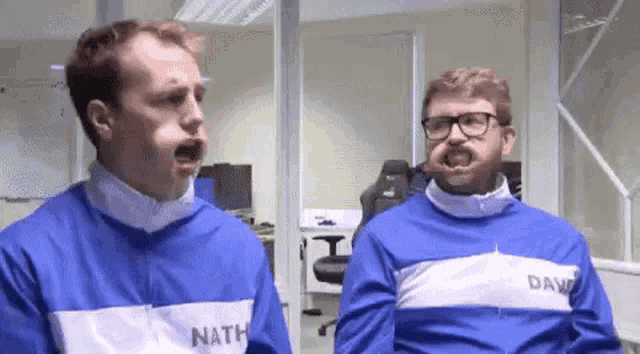 two men wearing blue and white jackets with nathan and dave on them