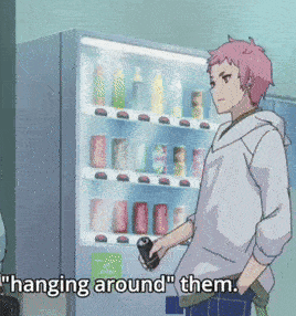 a man with pink hair is standing in front of a vending machine with the words " hanging around them " below him