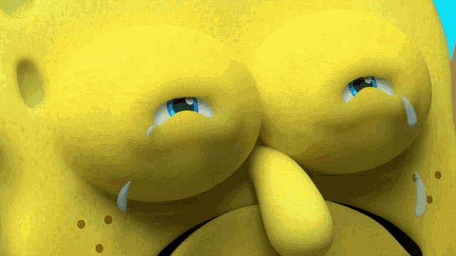 a close up of spongebob 's face with a tear coming out of his eyes