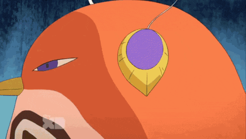 a close up of an orange bird with a purple pendant