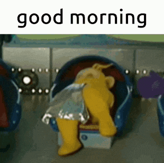 a teddy bear is sitting in a washing machine with the words `` good morning '' written on the bottom .