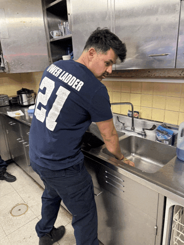 a man wearing a shirt with the number 21 on the back