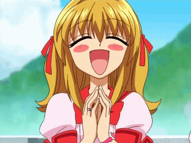 a girl with blonde hair and red bows on her ears is laughing