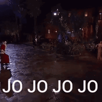 a man in a santa suit is holding a teddy bear and says `` jo jo jo jo '' .