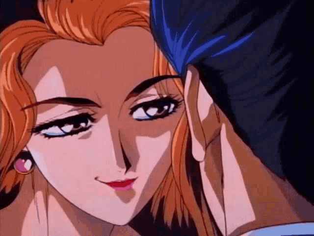 a man and a woman are looking at each other and the woman is smiling