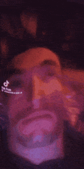 a close up of a person 's face with a tik tok watermark