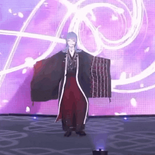 a person in a kimono is dancing on a stage in front of a pink background .